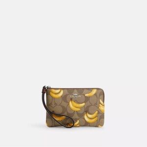 Coach Corner Zip Wristlet In Signature Canvas With Banana Print